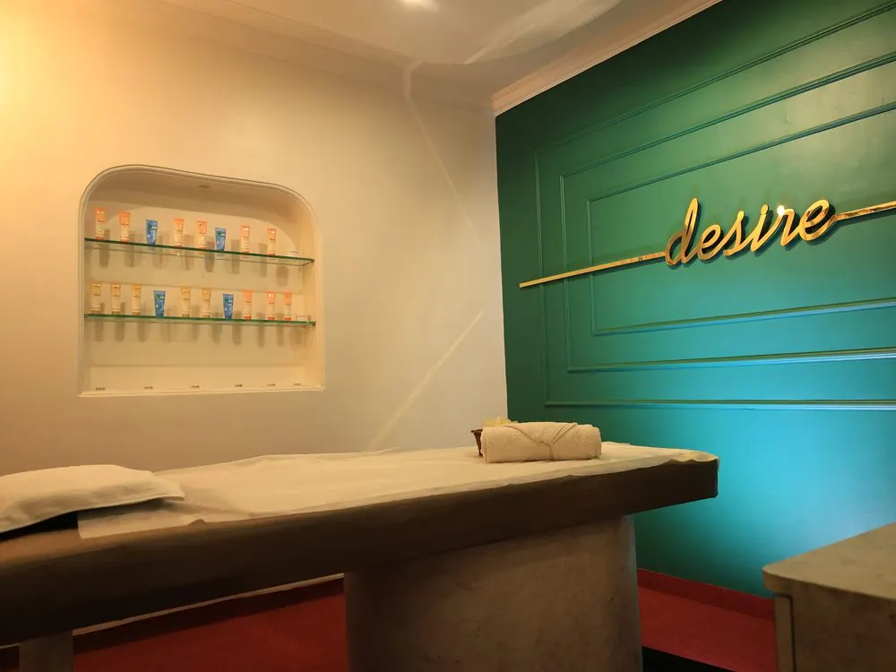Massage room stocked with fresh skincare products